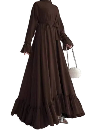 Brown long dress with ruffled sleeves and hem against a neutral background