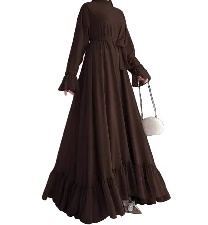 Brown long dress with ruffled sleeves and hem against a neutral background
