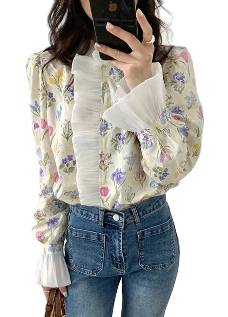 Elegant off-white floral long sleeve blouse with bell sleeves and a sophisticated turtleneck neckline.