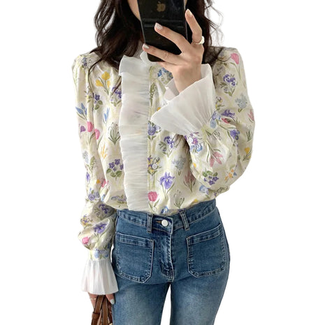 Elegant off-white floral long sleeve blouse with bell sleeves and a sophisticated turtleneck neckline.