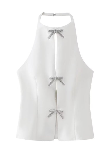 Elegant white halter top with a decorative bow detail and an open-back silhouette for sophisticated styling.