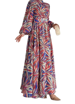 Colorful patterned dress worn by a person against a white background