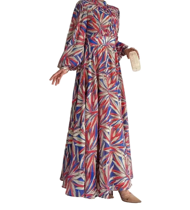 Colorful patterned dress worn by a person against a white background