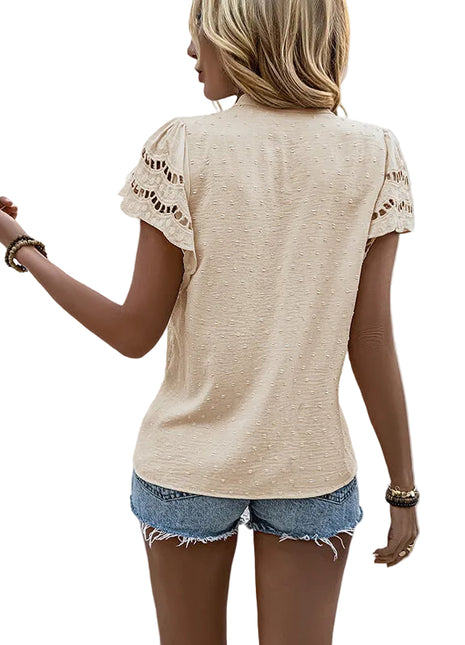 Fashionable short sleeve lace blouse paired with trousers for a polished business casual outfit.