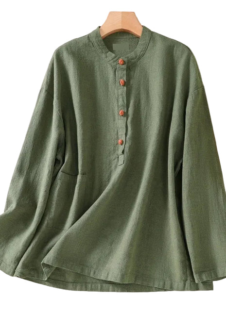 Grass green loose-fit Japanese-style shirt paired with linen trousers for an elegant commuter outfit.