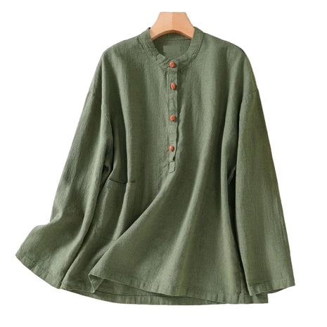 Grass green loose-fit Japanese-style shirt paired with linen trousers for an elegant commuter outfit.