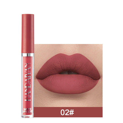A swatch of a liquid lipstick in a dark red shade, with the product's packaging indicating the shade as '01#'.