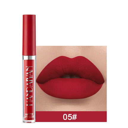 A swatch of a liquid lipstick in a dark red shade, with the product's packaging indicating the shade as '01#'.