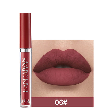 A swatch of a liquid lipstick in a dark red shade, with the product's packaging indicating the shade as '01#'.