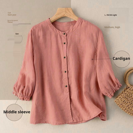 Pink cardigan on a hanger with annotations on a beige background