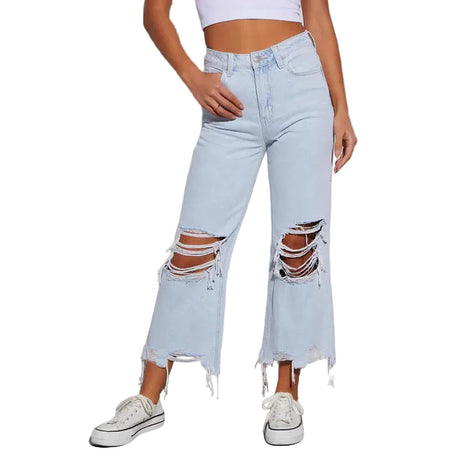 Women’s commuter style ripped jeans with cotton denim fabric and trendy cropped silhouette.