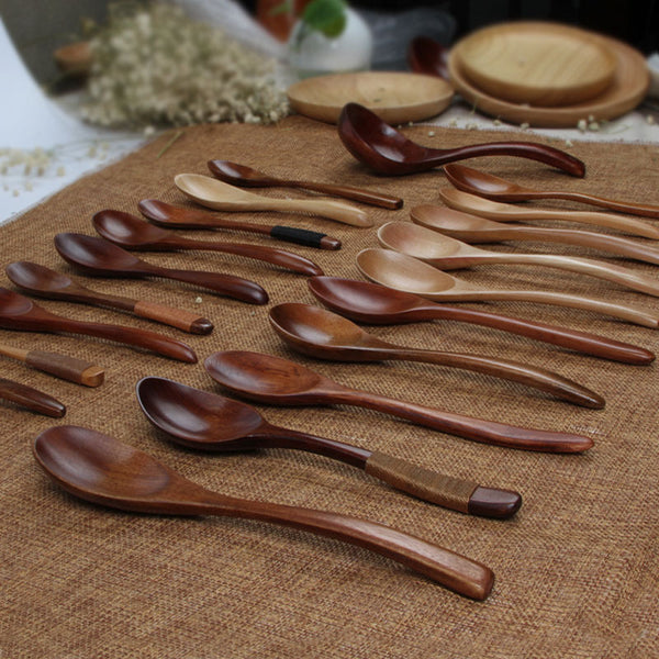 Set of wooden spoons on a textured surface