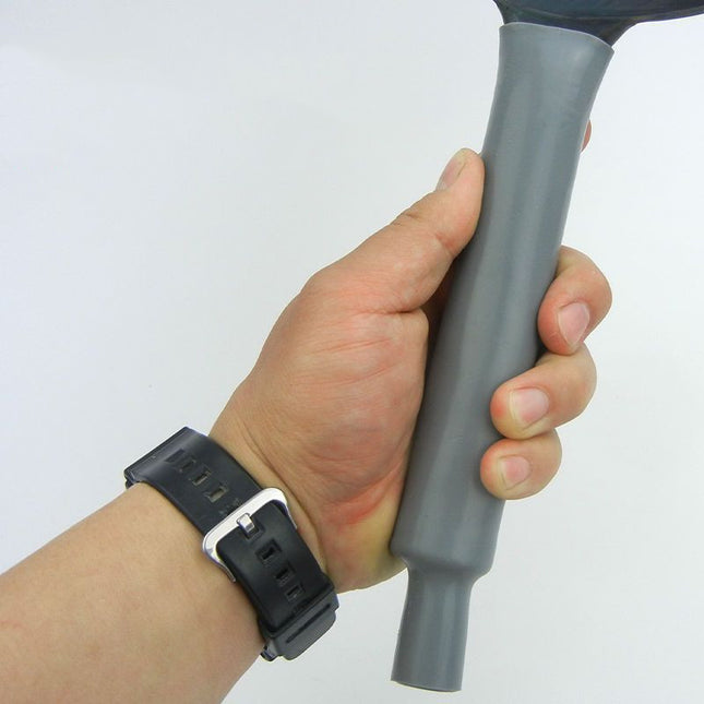 Hand holding a gray vacuum cleaner attachment against a white background