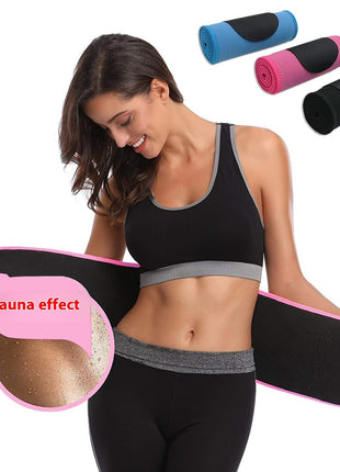 Woman wearing a black waist trainer with pink waistband, surrounded by rolled-up waist trainers.