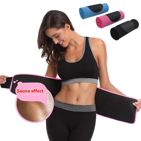Woman wearing a black waist trainer with pink waistband, surrounded by rolled-up waist trainers.