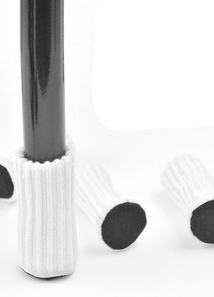 Chair and table leg covers with white cushion and black rubber tips on a white background.