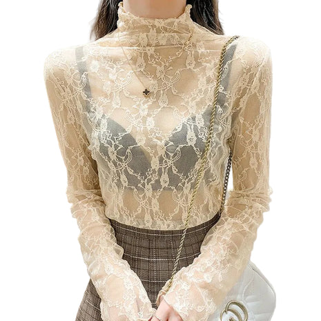Beige lace top worn by a person with a neutral background blndl