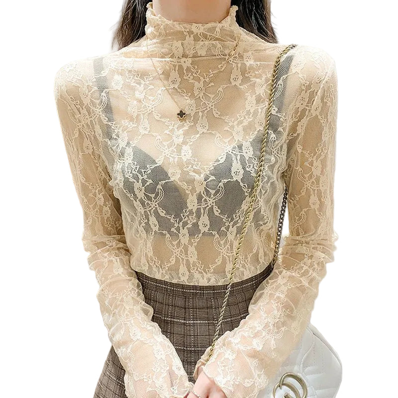 Beige lace top worn by a person with a neutral background blndl