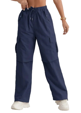 Loose fit high waist track pants for women with modern streetwear design and relaxed comfort.