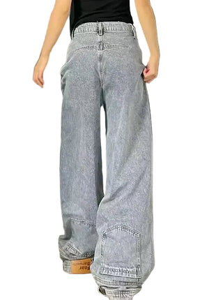 Loose straight denim jeans with mid waist design, distressed details, and casual urban fashion style.