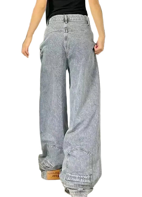 Loose straight denim jeans with mid waist design, distressed details, and casual urban fashion style.