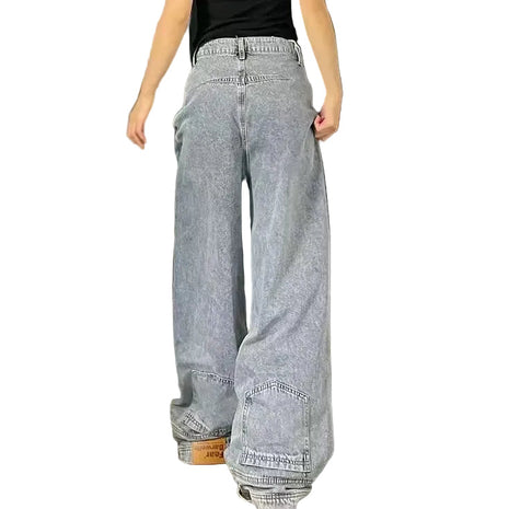 Loose straight denim jeans with mid waist design, distressed details, and casual urban fashion style.