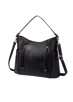 Black handbag with multiple pockets and straps on a white background