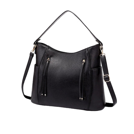 Black handbag with multiple pockets and straps on a white background