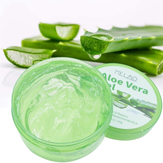 Aloe vera gel jar with fresh aloe leaves on a white background