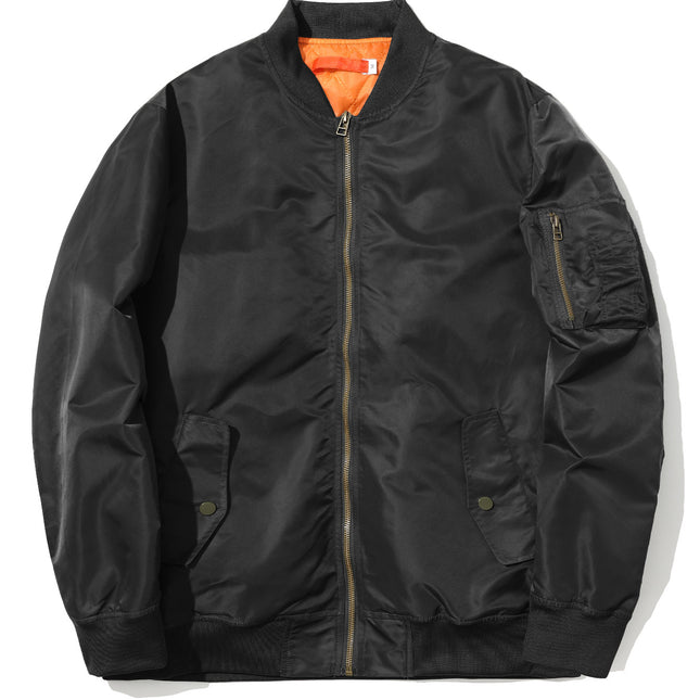 Black bomber jacket with orange lining on a white background