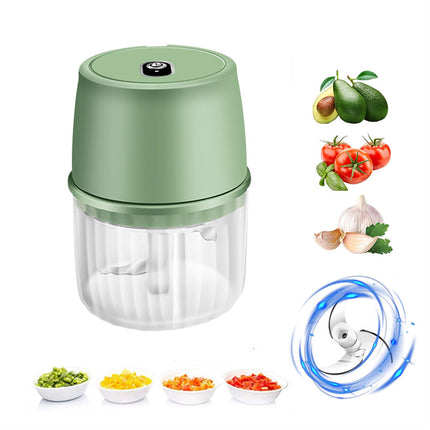Green handheld food chopper with images of ingredients and a close-up of the blade on a white background