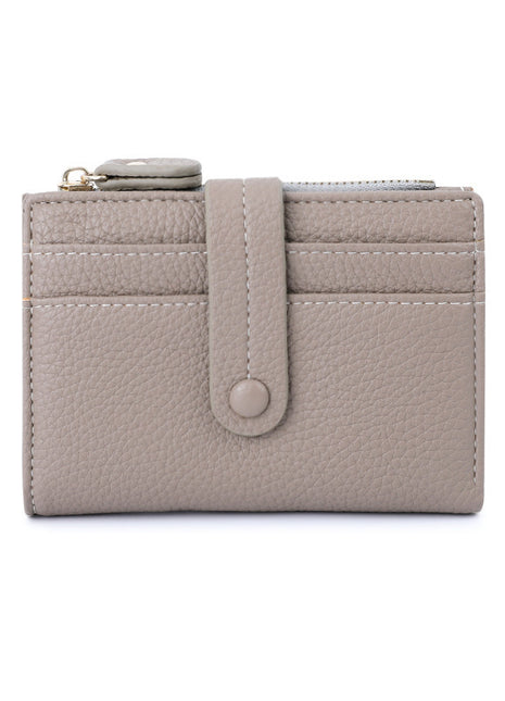 Minimalist small wallet featuring button closure and organized card storage.