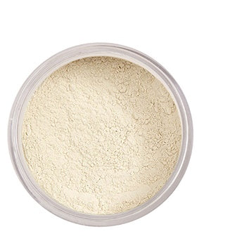 Beige powder in a clear container on a white background