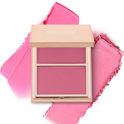 A selection of PHOFAY Duo Cream & Powder Blush products displayed on a pink surface, with the words 'JUST ENOUGH' visible in the image. The products come in golden-colored compact cases with brushes on one side and pink and red blush shades on the other.