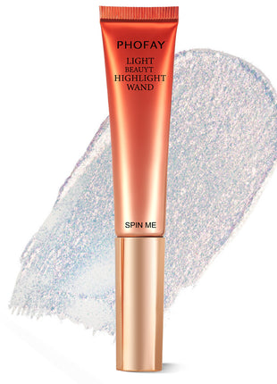 A PHOFAY Highlighter Wand in a golden bronze shade, with a swatch of the product showing its luminous and creamy texture.