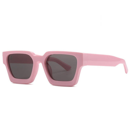 Pink sunglasses with dark lenses on a white background