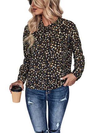 Pullover black blouse with a feminine bow neckline and comfortable long sleeve design.