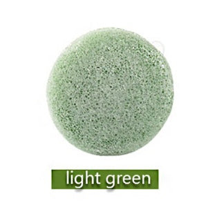 Light green sponge ball on a white background