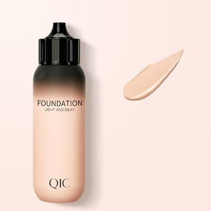 QIC foundation bottle with a swatch on a light beige background