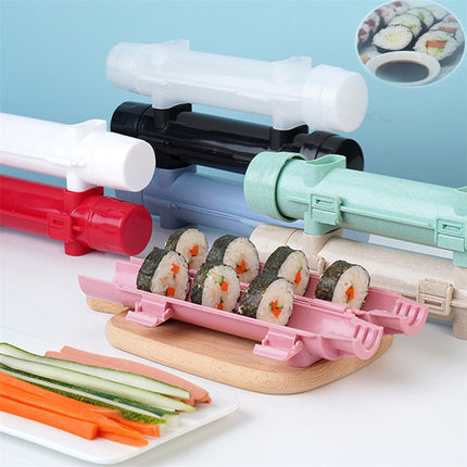 Sushi-making kit with colorful rollers and pre-made sushi on a light blue background
