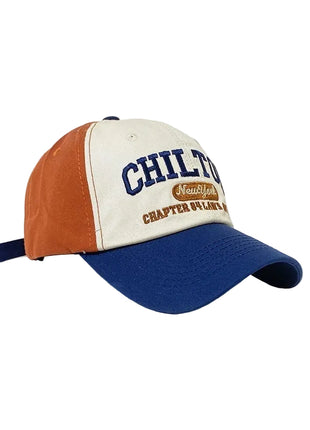 Retro colorblock baseball cap with text on a white background