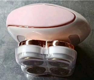Pink and rose gold electronic device on a gray background