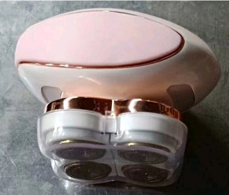 Pink and rose gold electronic device on a gray background