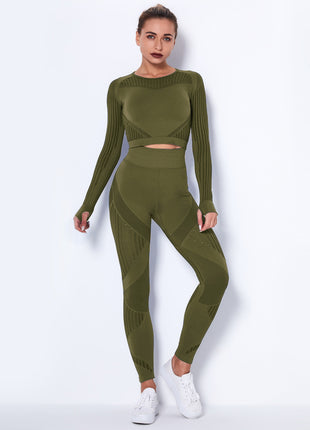 Woman wearing a green knit outfit on a white background