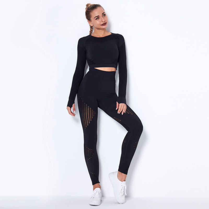Woman wearing a black athletic outfit on a white background