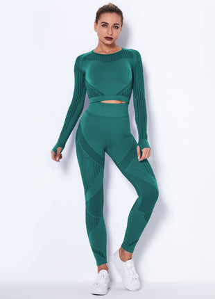 Woman wearing a green athletic outfit on a white background