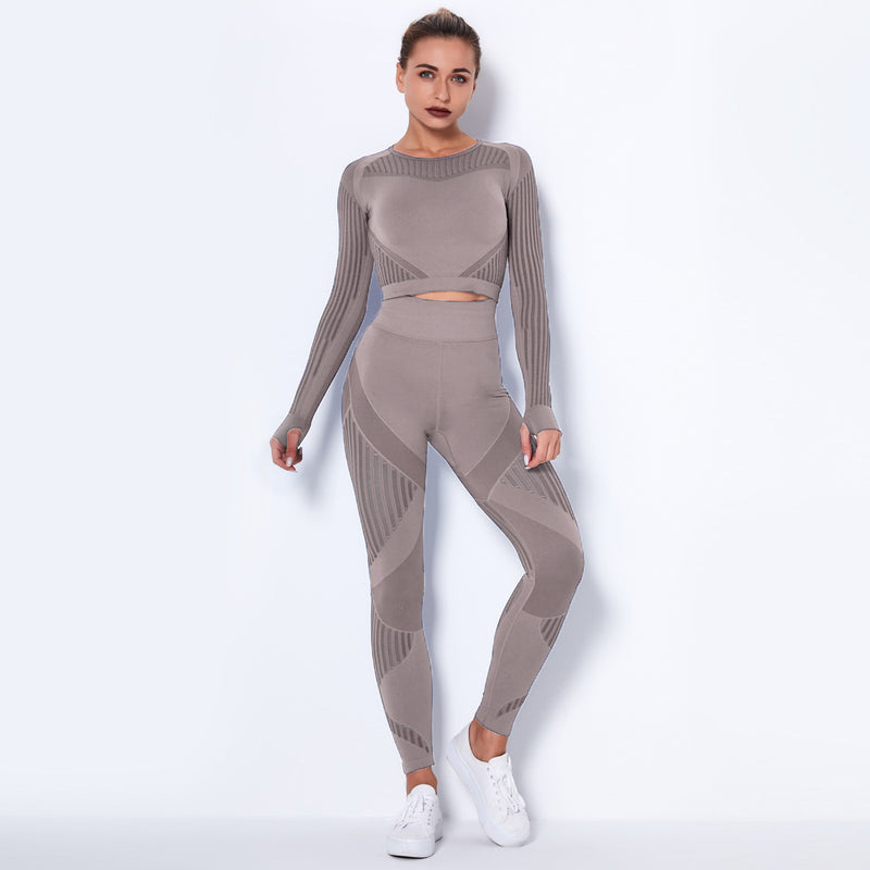 Woman wearing a gray knit outfit on a white background