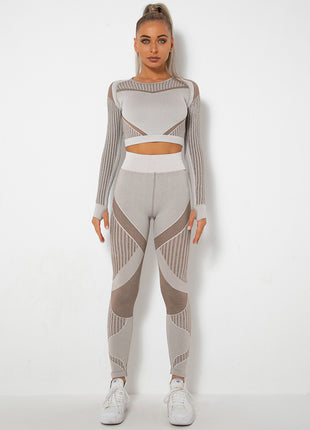 Woman wearing a gray and white patterned outfit on a white background