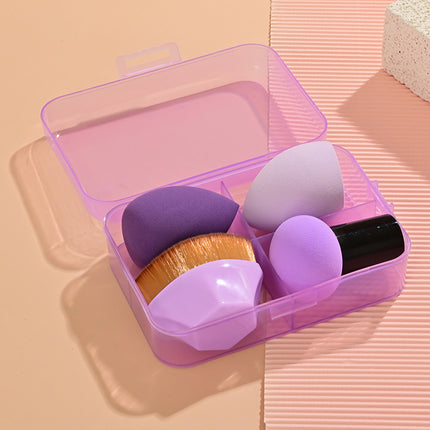 Set of makeup sponges in a clear pink case on a beige background
