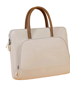 Light gray handbag with brown handle on a beige background